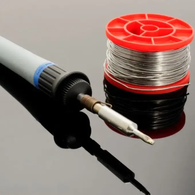 Soldering iron and solder